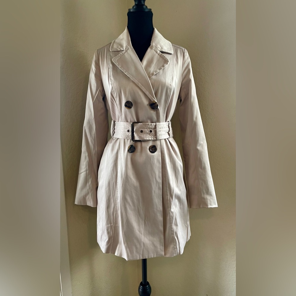 Cream Bebe trench coat.